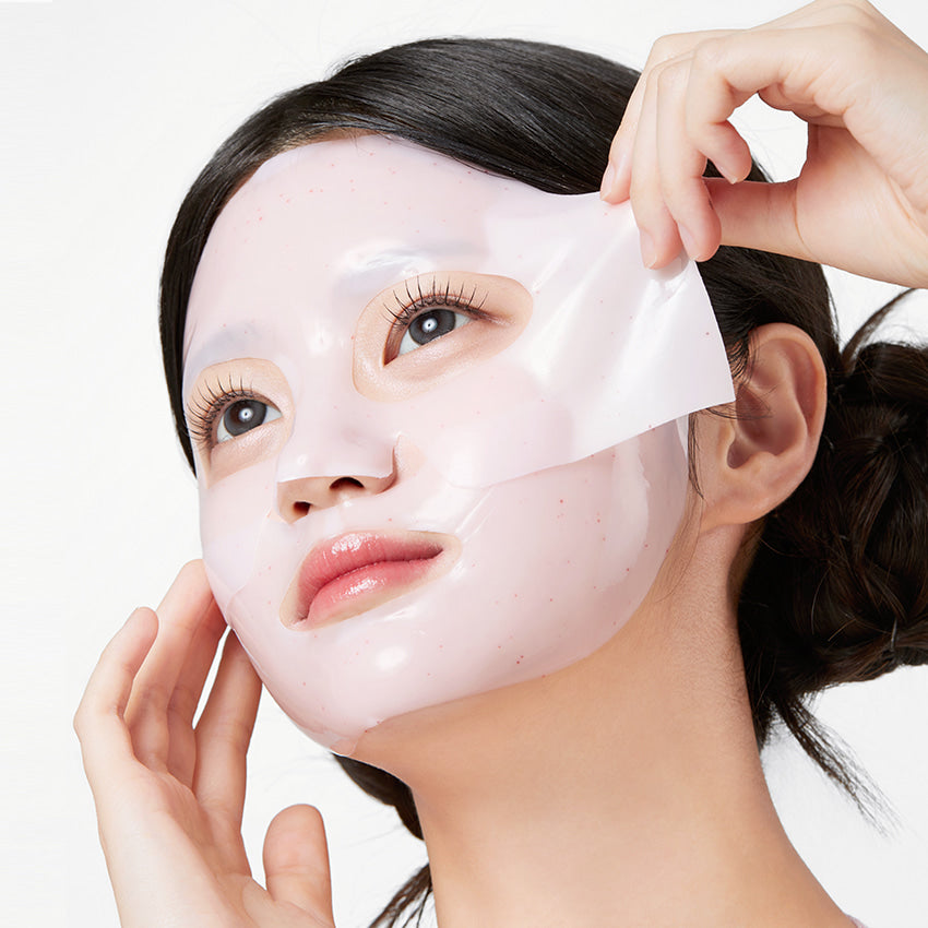 Woman applying APRILSKIN TXA Niacinamide Collagen 99 Capsule Gel Mask 4 Sheets for skincare