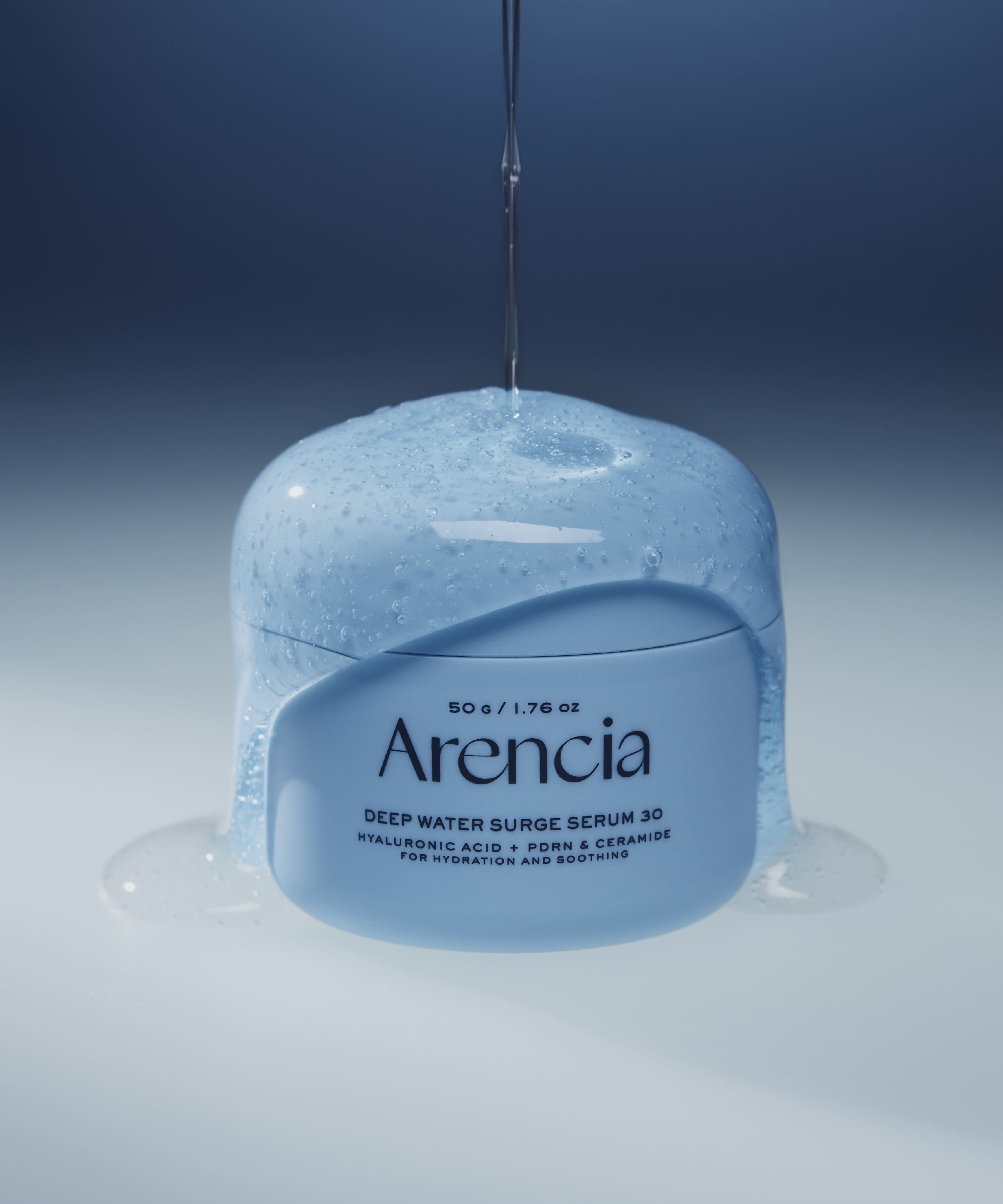 ARENCIA Deep Water Surge Serum 30 50g with hydrating formula dripping on blue jar.