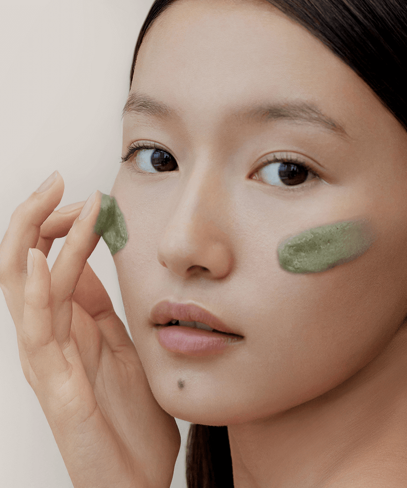 Woman applying ARENCIA Green Tea + LHA Deep Pore Rice Cake Soap 150ml on face