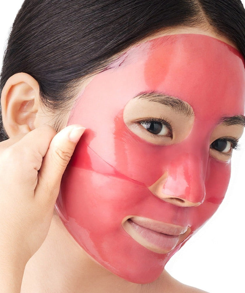 Woman applying ARENCIA Red Collagen Gel Mask 4 Sheets for skincare.