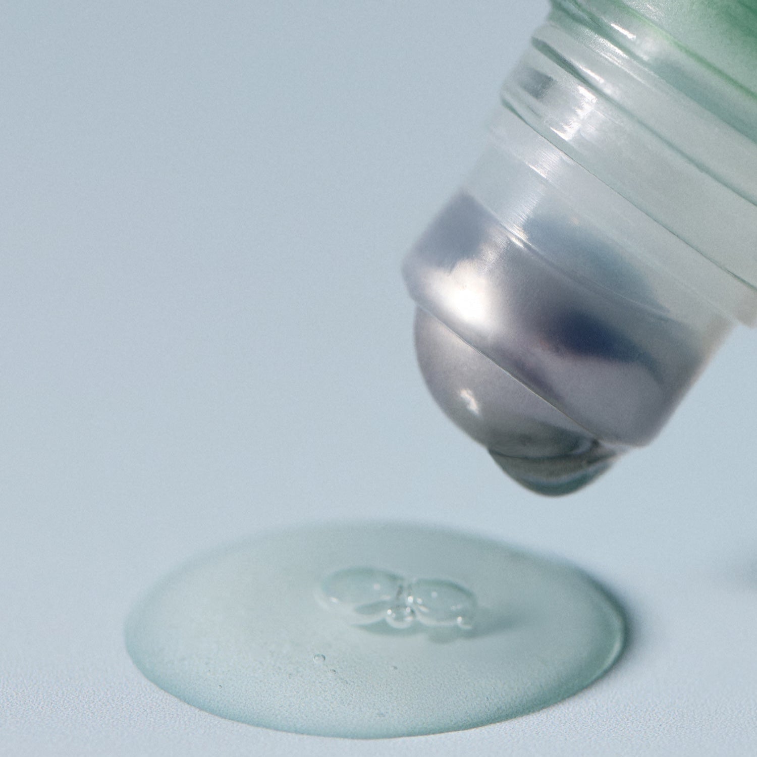 Close-up of AROMATICA Rosemary Root Volumizing Scalp Ampoule 20ML applicator dispensing product.