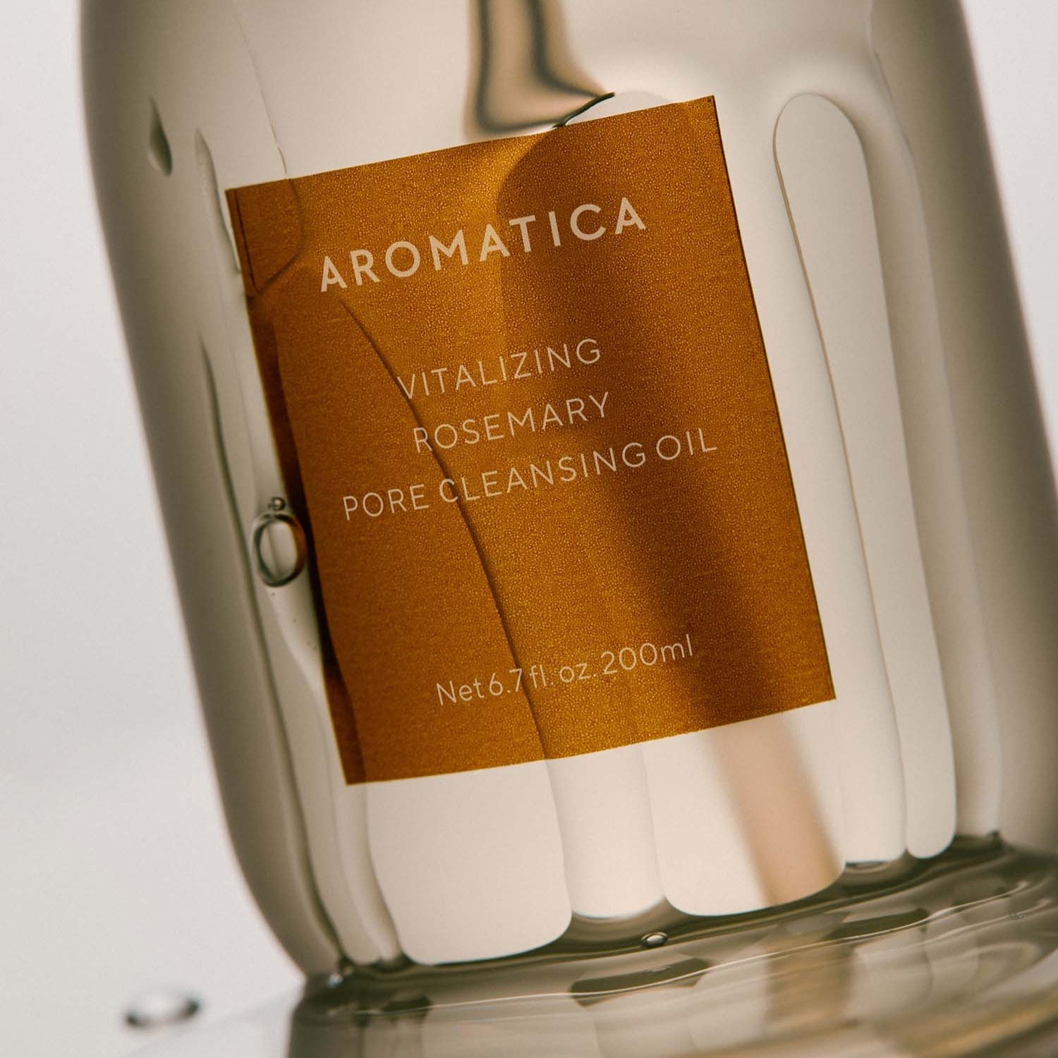 AROMATICA Vitalizing Rosemary Pore Cleansing Oil 200ML bottle on reflective surface