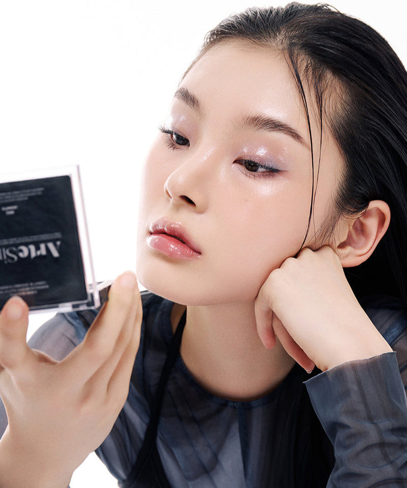 Person using ARTESINSA Unvoiced Eye Palettes, highlighting exquisite eyeshadow application and innovative makeup design.