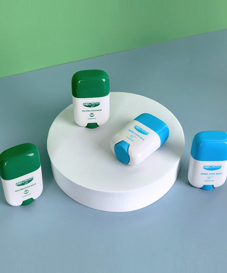 ATOMANDE Phyton Stick Balm 16.5g 1ea shown on display against a green background