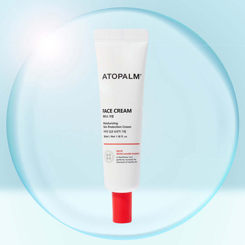 ATOPALM Face Cream 35ml tube with red cap on a light blue background