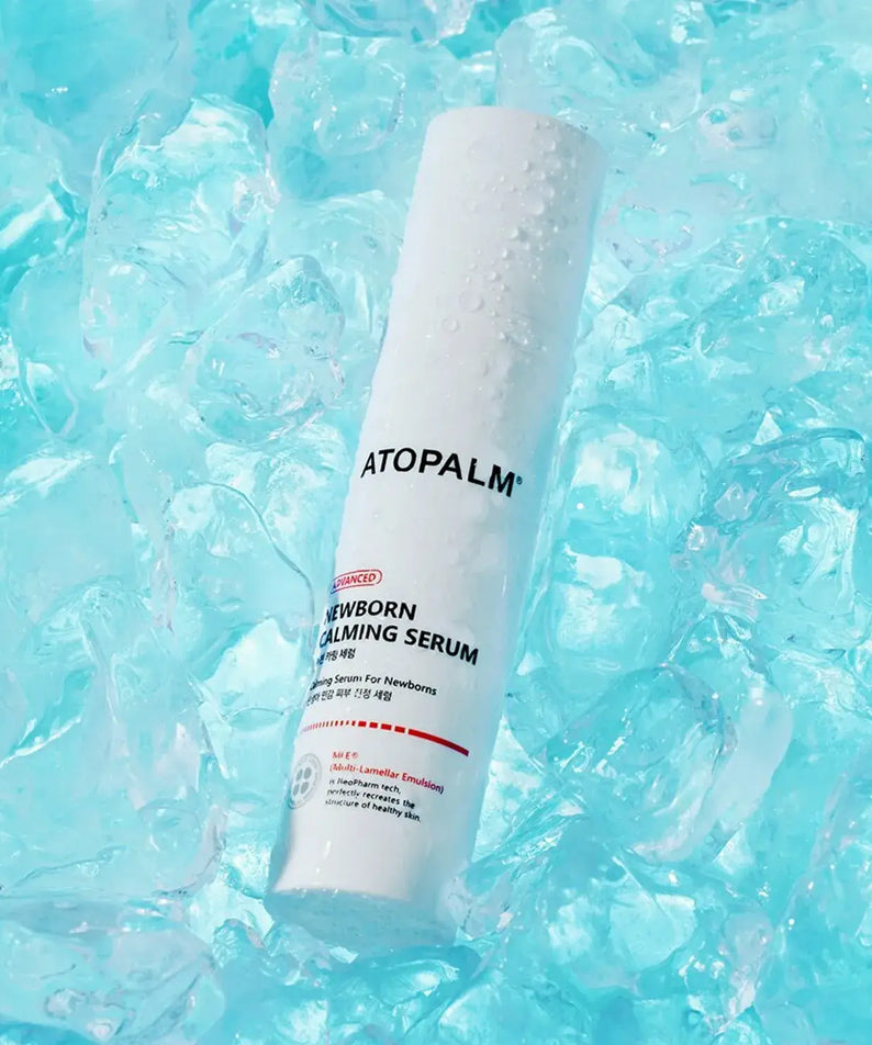 ATOPALM Newborn Calming Serum 50ml bottle in ice, highlighting hydrating properties