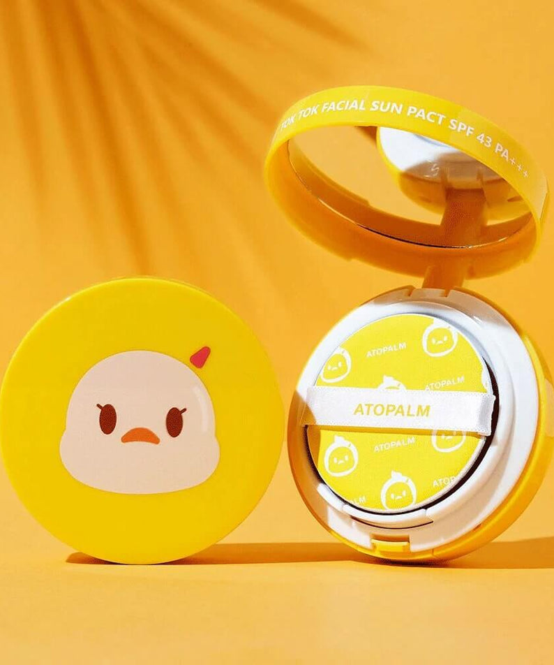 ATOPALM Toktok Facial Sun Pact SPF43 PA+++ 15g in yellow compact with mirror on orange background