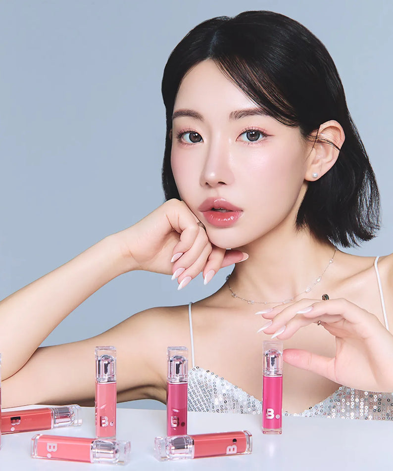 Model displaying BANILA CO Dew Glow Tint collection in various shades.