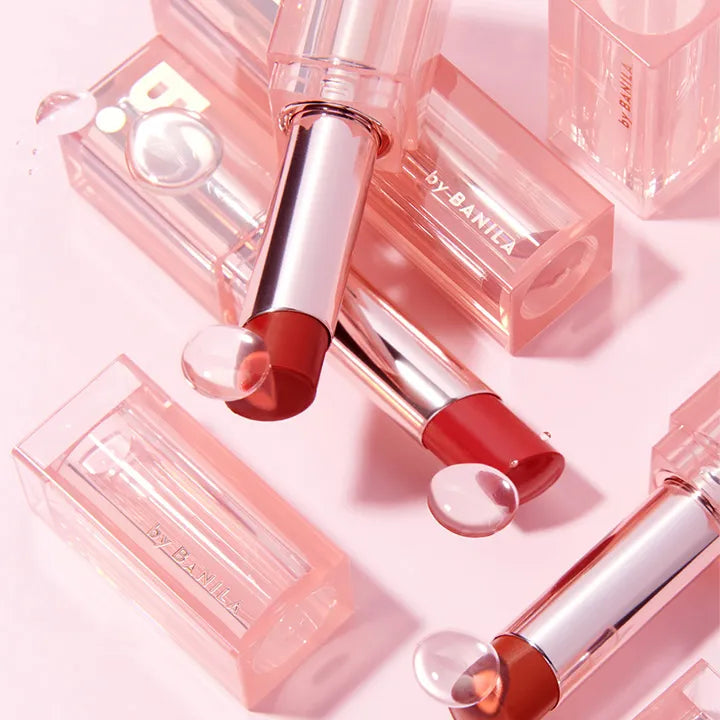 BANILA CO Glow Veil Lipstick in stylish packaging on a pink background.