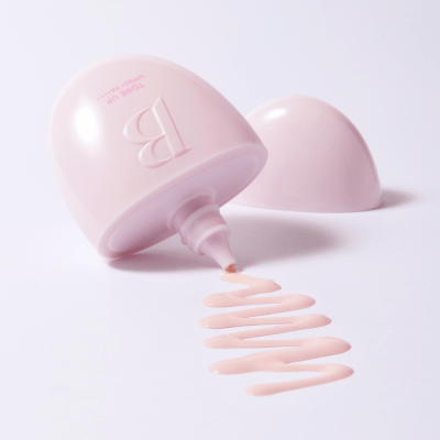 BANILACO All Day Prep Tone Up Base Cream SPF50+PA++++ pink tube with cream spilling on white background