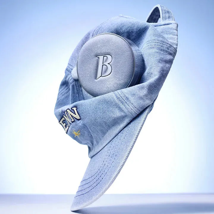 BANILACO Covericious Ultimate White Cushion displayed with a blue denim cap for a stylish look.
