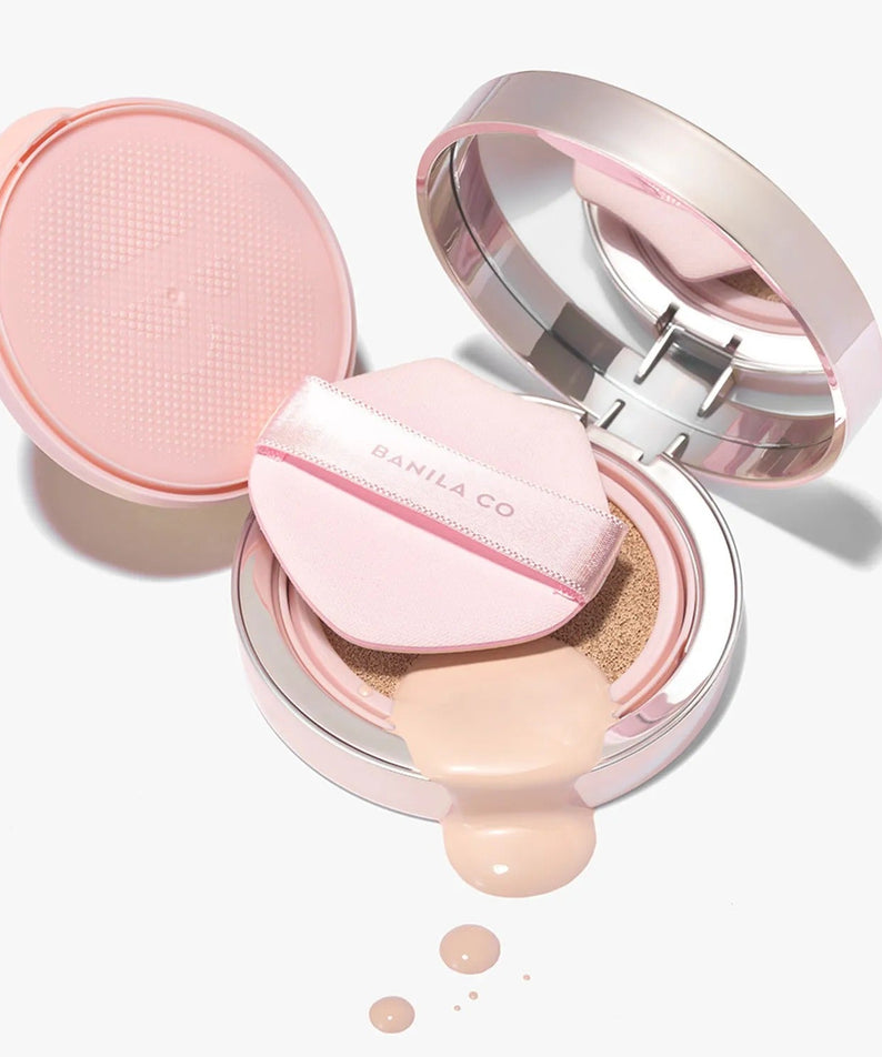 BANILACO Essence Skin Pink Cushion makeup compact with applicator and liquid foundation spill on white background