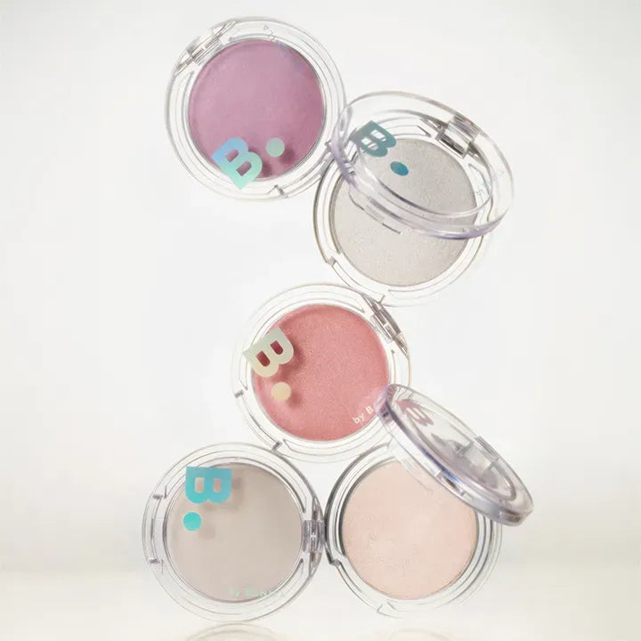 Assorted shades of BANILACO Silky Glow Highlighter in clear compact cases displayed against a neutral background.