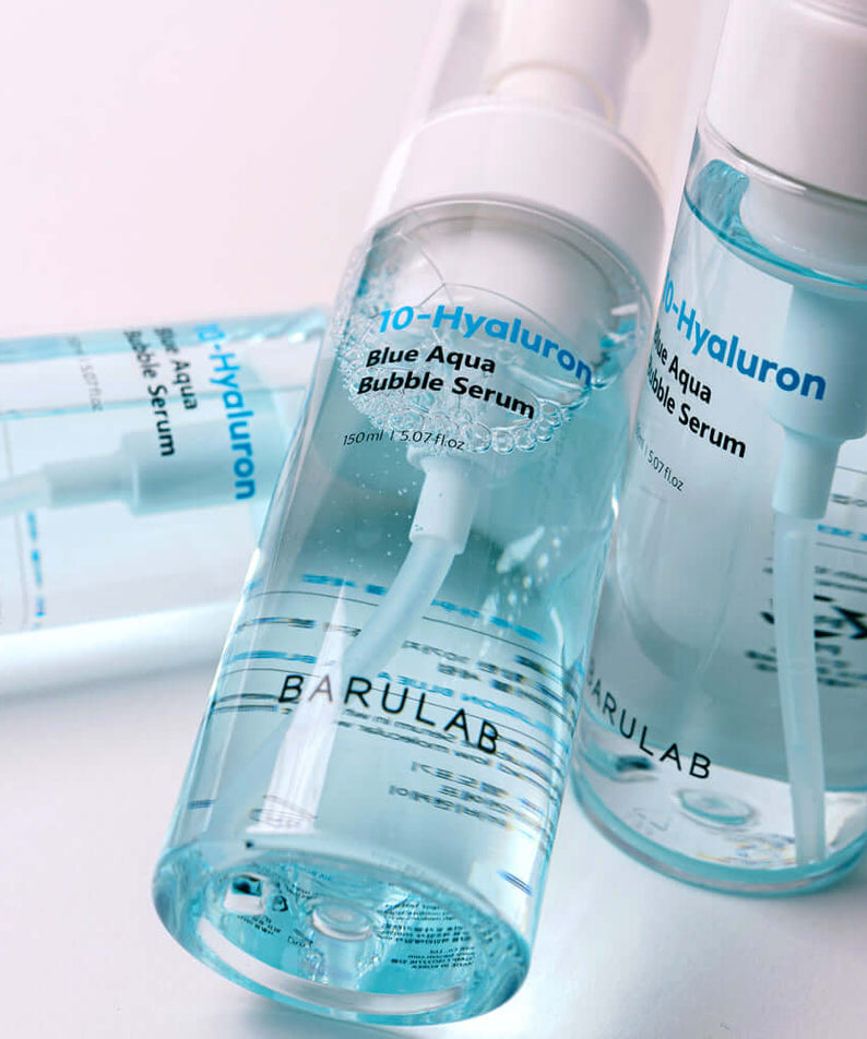 BARULAB 10-Hyaluronic Acid Blue Aqua Bubble Serum in clear bottles with pump dispensers, showcasing the serum's packaging and color.
