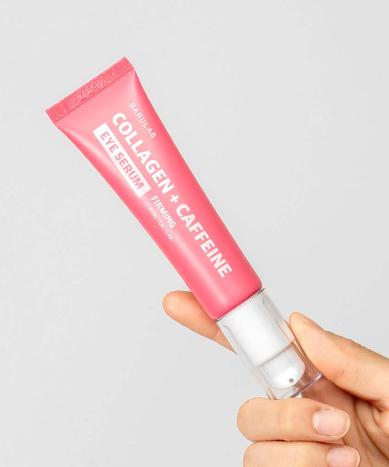 BARULAB Collagen Caffeine Elasticity Eye Serum 30ml in a pink tube held by a hand, showcasing product packaging and design.