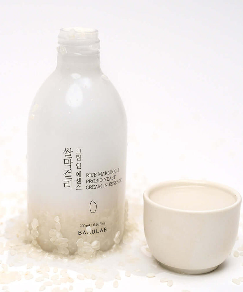 BARULAB Rice Makgeolli Probiotic Yeast Cream in Essence 200ml bottle with cup and scattered rice
