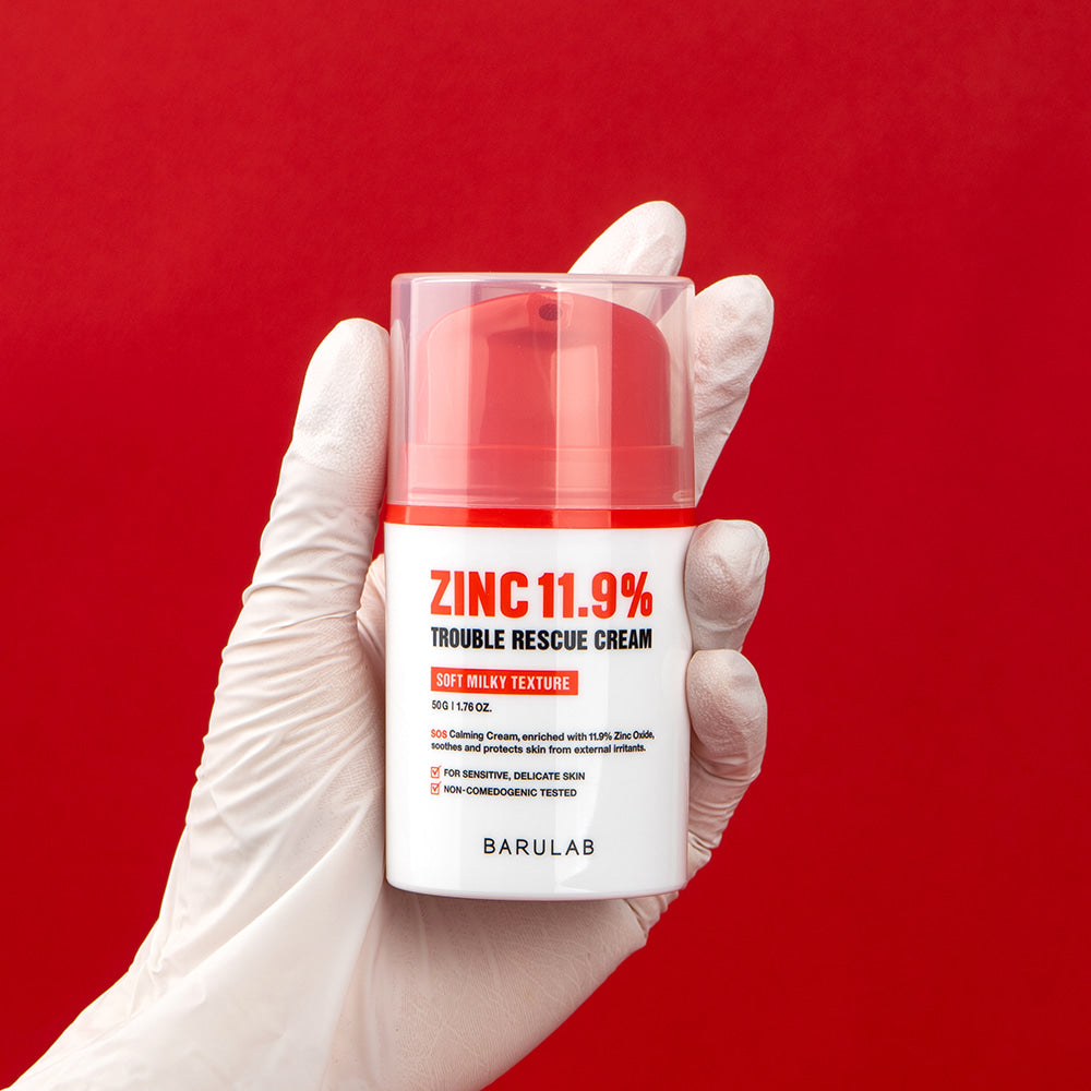 BARULAB Zinc 11.9 Percent Trouble Rescue Cream in hand, red background