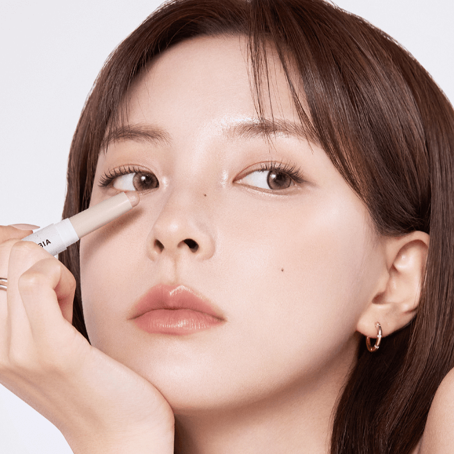 Woman applying BBIA Last Contour Stick near eye for contouring.