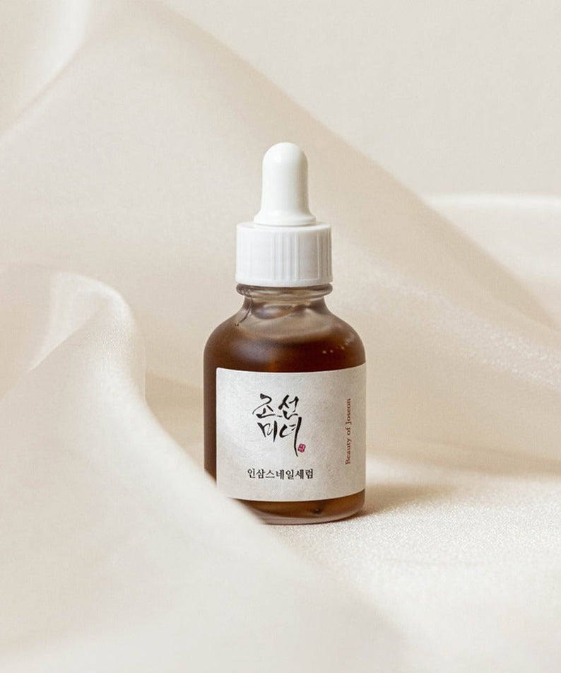 BEAUTY OF JOSEON Ginseng Snail Serum 30ml bottle on silky background.