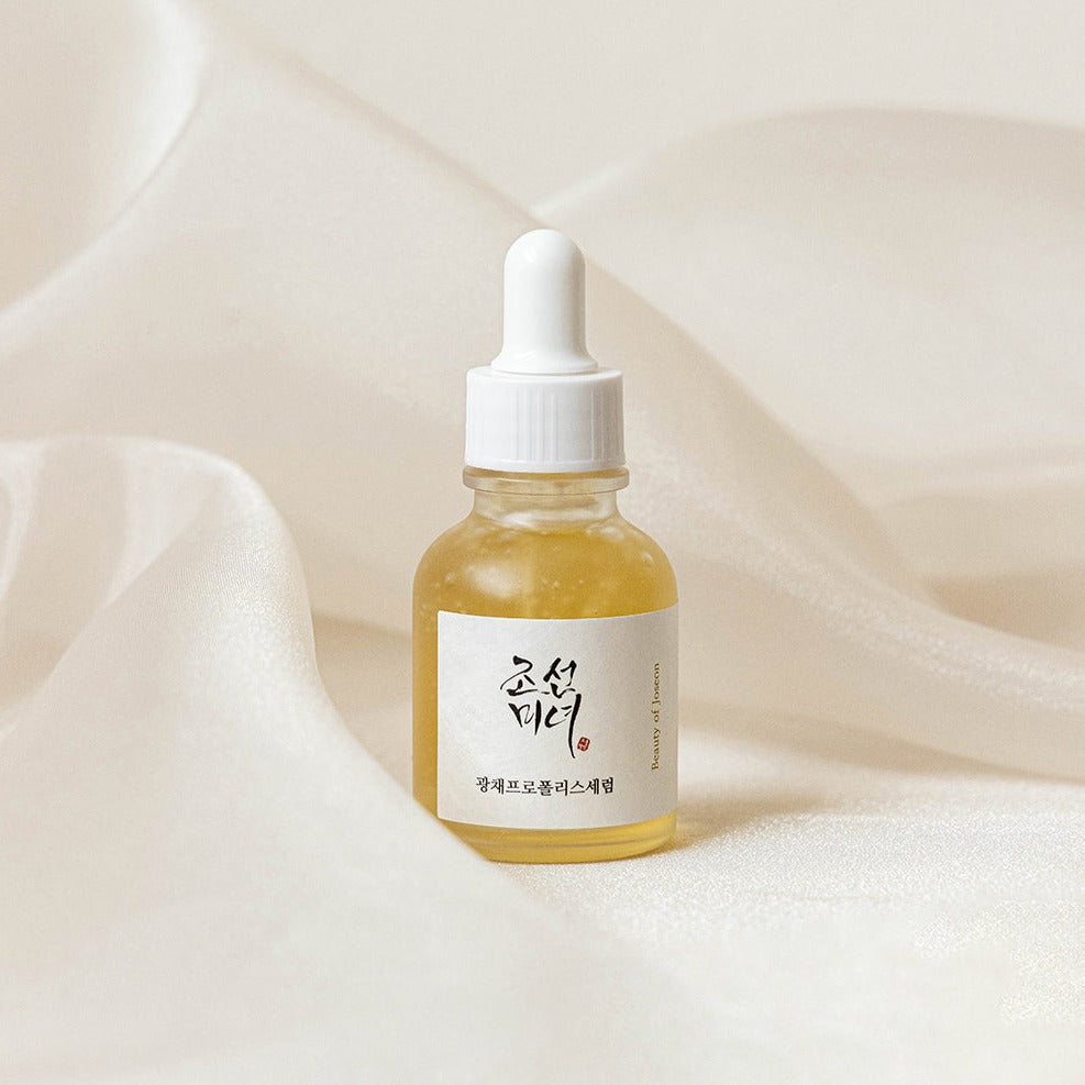 BEAUTY OF JOSEON Glow Propolis Serum 30ml bottle on elegant fabric background for skincare