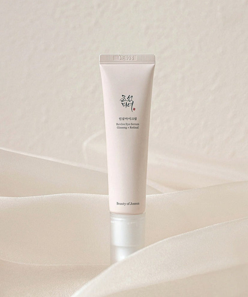 BEAUTY OF JOSEON Revive Eye Serum 30ml tube on elegant fabric background
