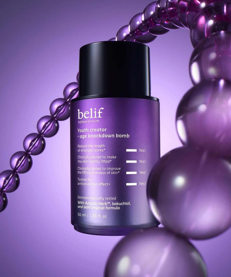 BELIF Age Knockdown Bomb Serum 50ml with purple background and beads.
