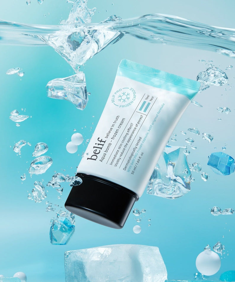 Image of BELIF Aqua Bomb Frozen Cream 50ml surrounded by ice and water, highlighting its hydrating and cooling properties.
