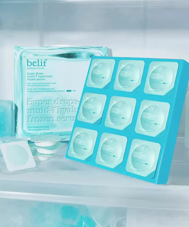 BELIF Super Drop Frozen Serum 5ml displayed in a refrigerator, showcasing packaging with ice cubes and a cool blue color scheme.