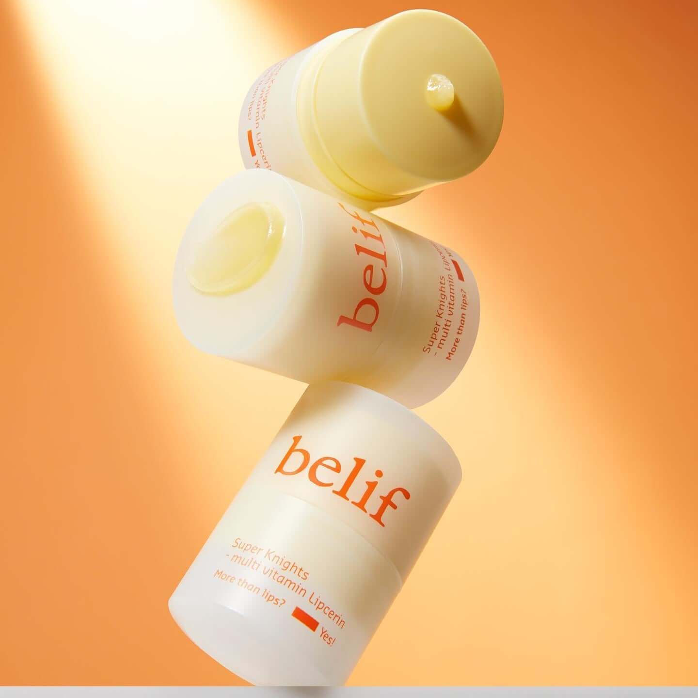 BELIF Super Knight Multi Vitamin Lipcerin, stacked containers against an orange background.