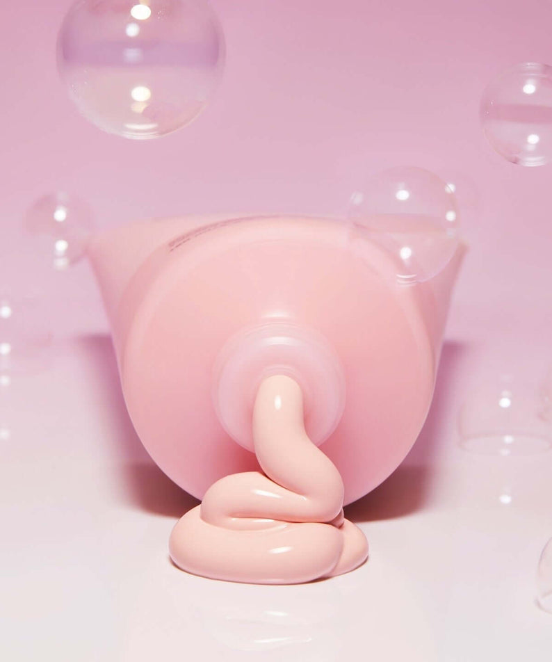 BELIF Super Knights Pore Fiming Vegan Pack Cleanser 150ml with creamy texture and pink packaging, surrounded by soap bubbles.