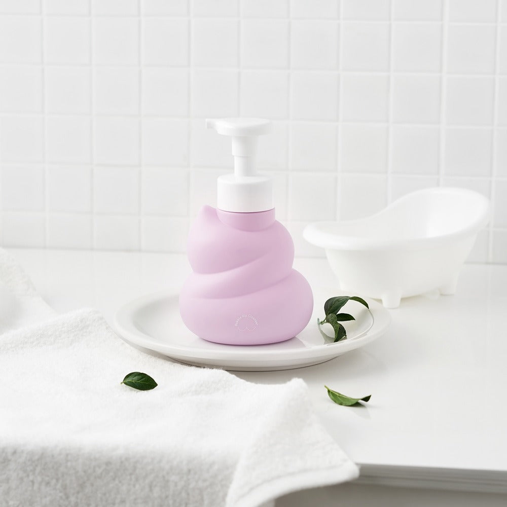 BELLBOY STUDIO Hippong Bubble Butt Cleanser in a stylish bottle on a bathroom counter next to a mini bathtub and towel
