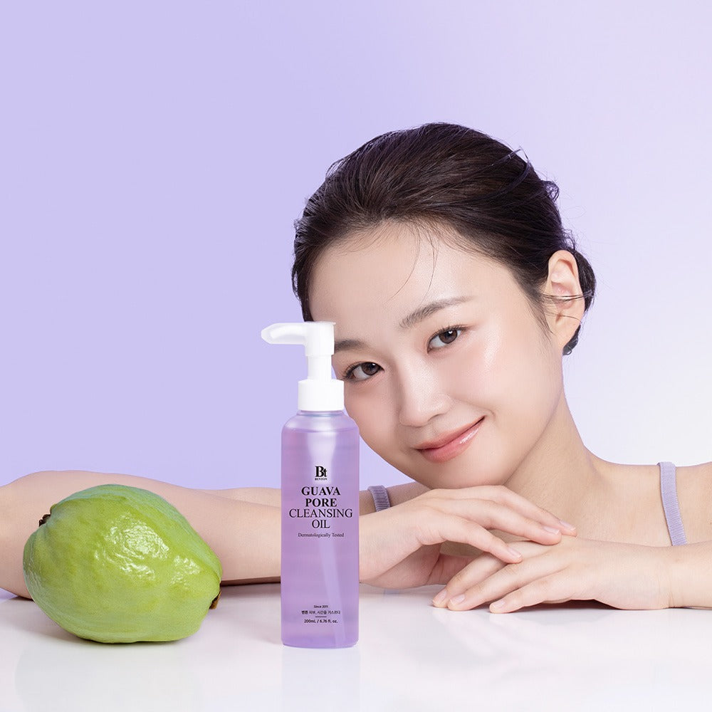 BENTON Guava Blackhead Pore Cleansing Oil 200ml next to smiling woman and guava fruit