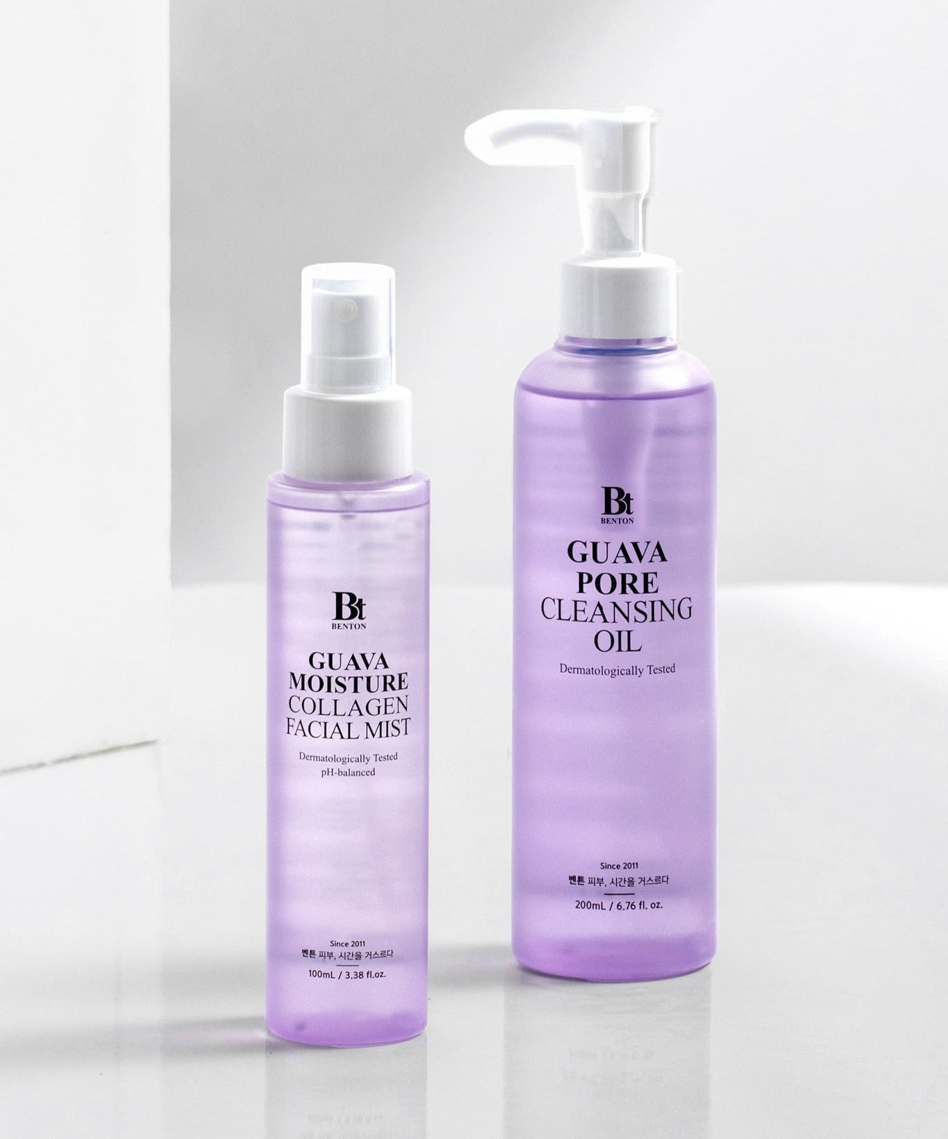 BENTON Guava Hydrating Collagen Mist 100ml bottle next to a cleansing oil bottle on a white background