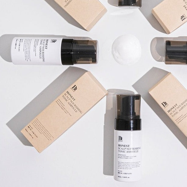 BENTON Honest Scalp Nourishing Tonic Ampoule 100ml bottles and packaging arranged artistically on a white background.