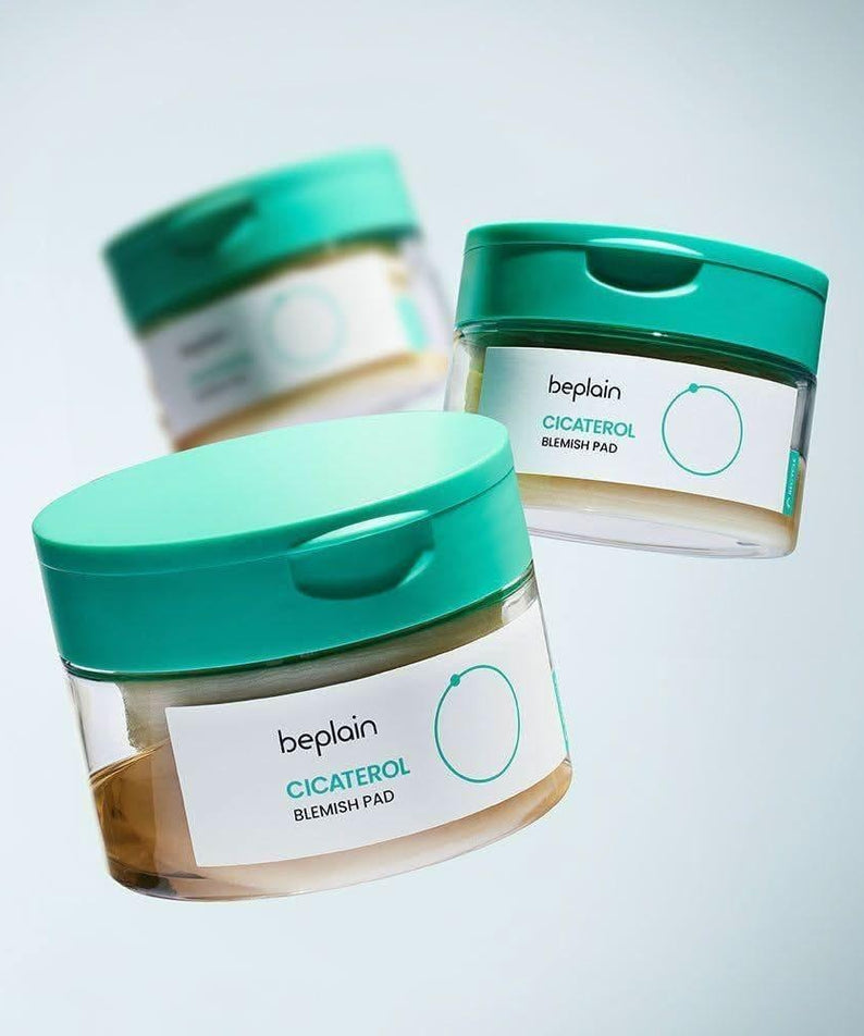 BEPLAIN Cicaterol Blemish Pad 80 sheets in teal jars floating against light background
