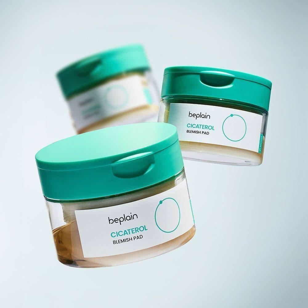 BEPLAIN Cicaterol Blemish Pad 80 sheets in teal jars floating against light background
