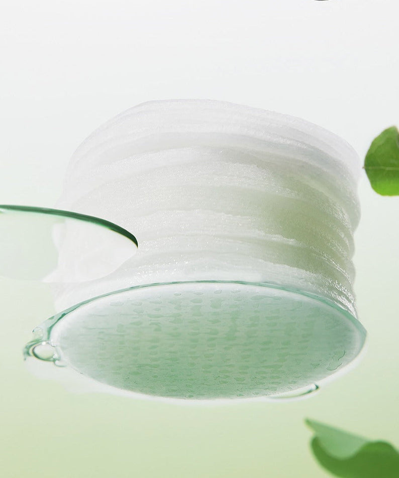 BEPLAIN Green Bean Pore Clearing Filter Pad 70 Sheets floating in water with green background