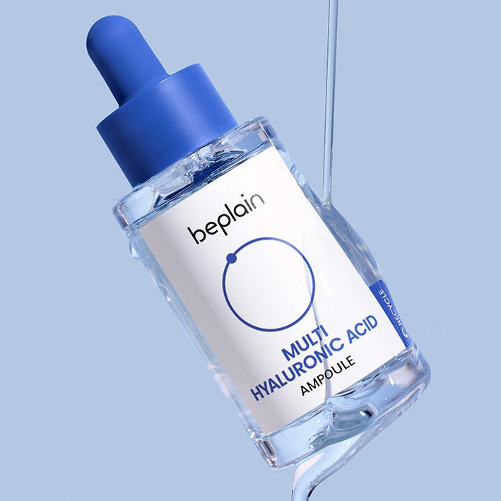 BEPLAIN Multi Hyaluronic Acid Ampoule 30ml in transparent bottle with blue dropper against a light blue background