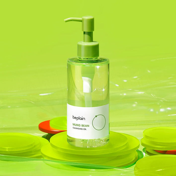 BEPLAIN Mung Bean Cleansing Oil in clear pump bottle with lid on neon green background
