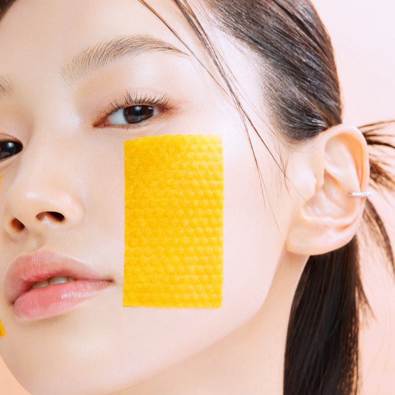 Woman applying BIO HEAL BOH Vita Synergy Spot Toning Serum Pad 70 sheets to face