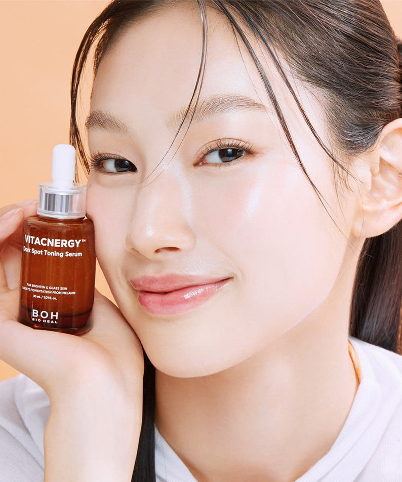 Woman holding BIO HEAL BOH Vitacnergy Dark Spot Toning Serum for radiant skin