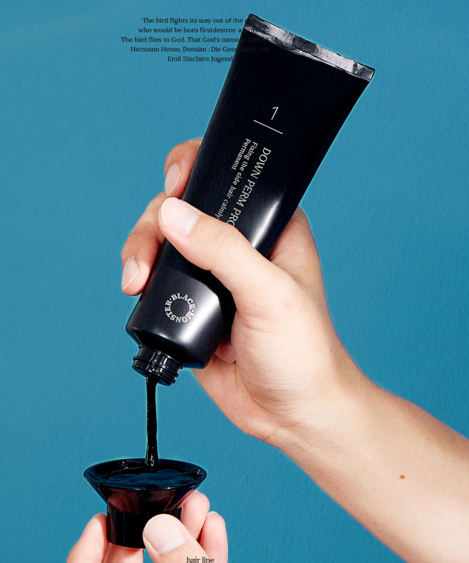 BLACK MONSTER Downperm Pro Kit 120ml held by a gentleman pouring black solution into a small bowl for professional Korean men's grooming by Gentleman Korea