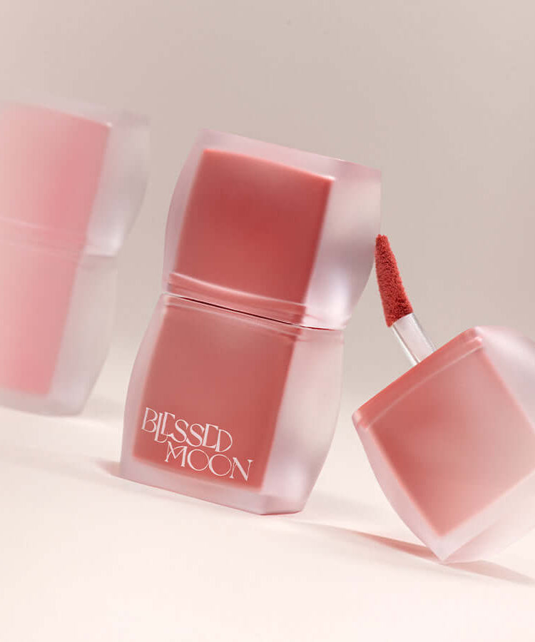 BLESSED MOON Veil Blur Lip Tint in soft focus showcasing trendy container and applicator.