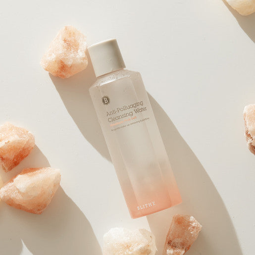 BLITHE Anti-Polluaging Cleansing Water 250ml bottle surrounded by rocks