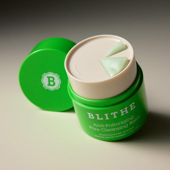 BLITHE Anti-Polluaging Pore Cleansing Balm in green container with open lid showing texture and product label.
