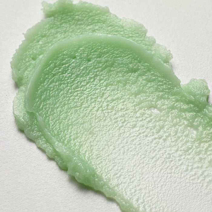 Texture of BLITHE Anti-Polluaging Pore Cleansing Balm with green, creamy consistency for skin care.