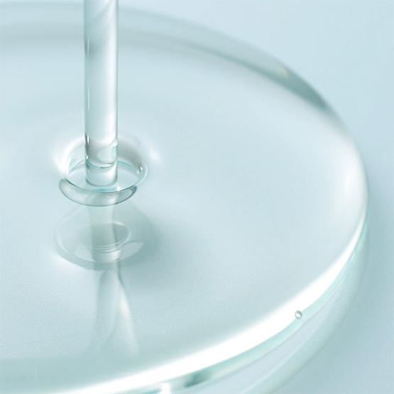 Close-up of BLITHE Targeted Pore Serum Niacinamide 22 30ml being poured, showcasing its clear texture and smooth consistency.