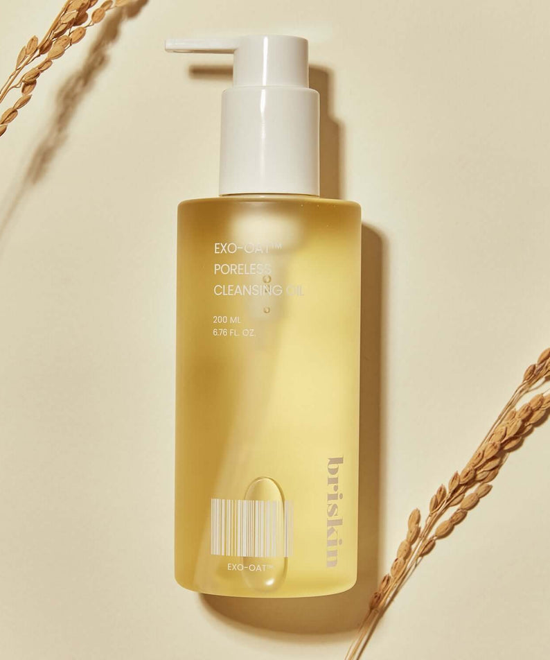 BRISKIN Exo-Oat Poreless Cleansing Oil 200ml bottle on beige background with oat sprigs