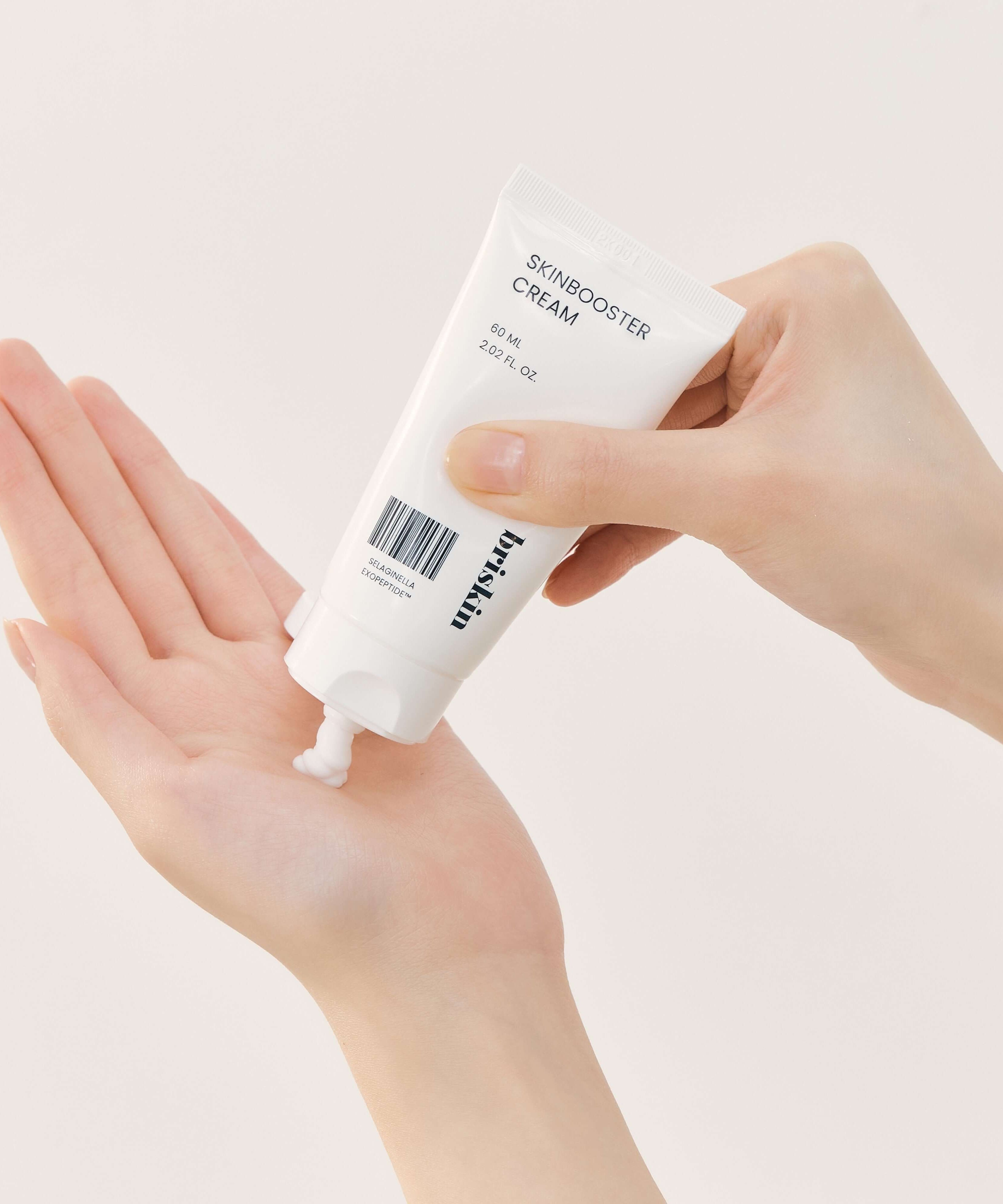 Person applying BRISKIN Selaginella Exopeptide Skin Booster Cream 60ml on hand.