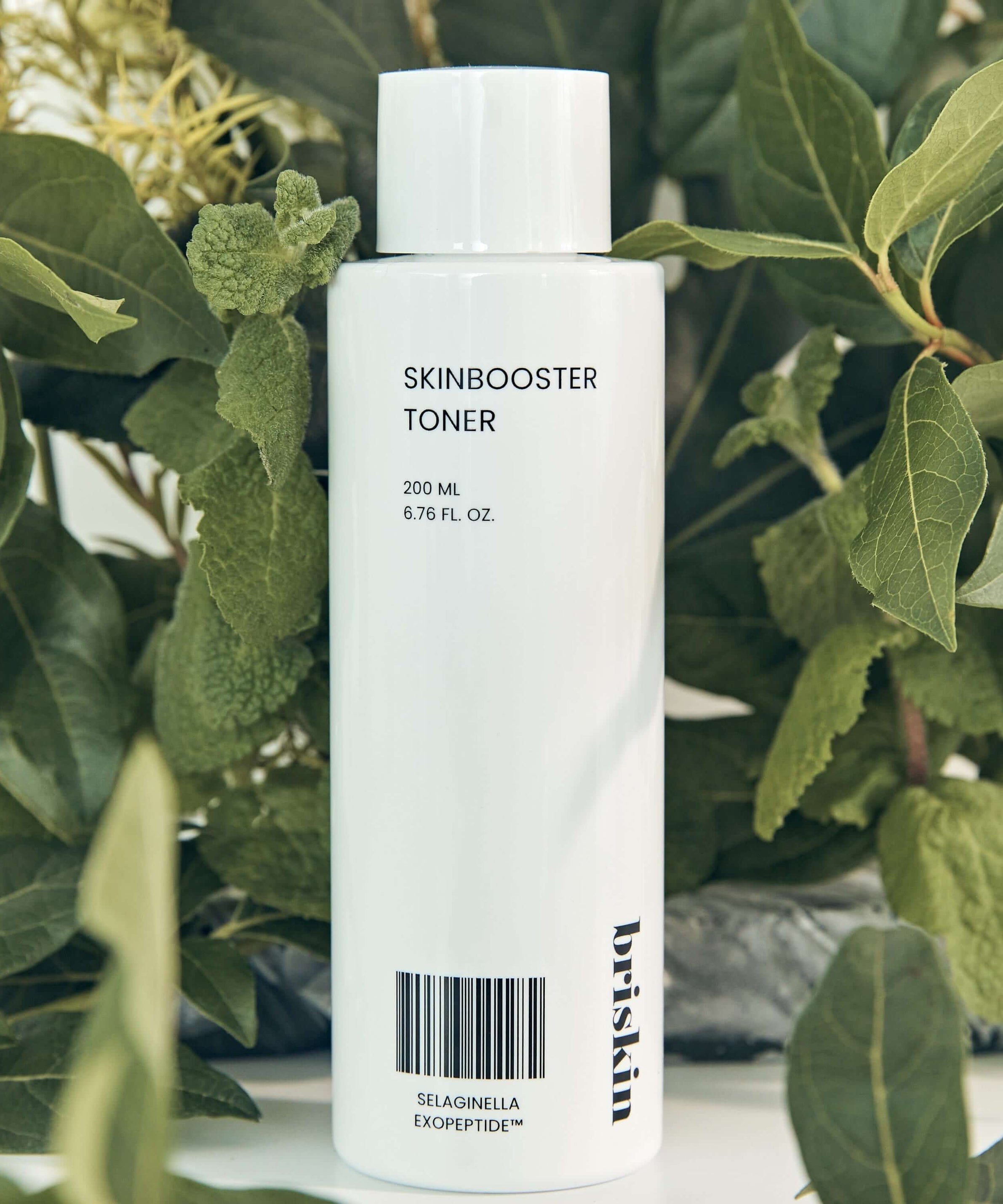 BRISKIN Selaginella Exopeptide Toner 200ml with lush green foliage background